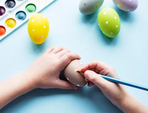 Hands of a girl with a Easter eggs Stock Photos