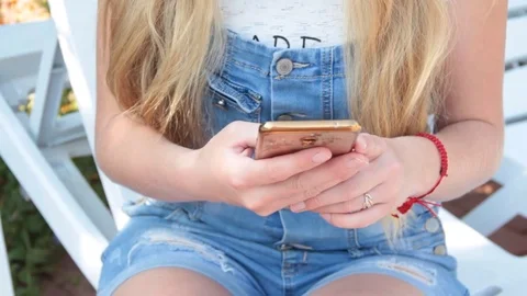 Hands of the girl with the phone Stock Footage 80656459