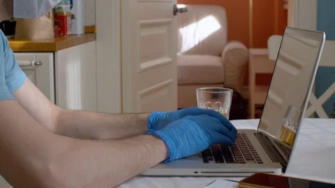 Hands in gloves on a keyboard Stock Footage 127078741