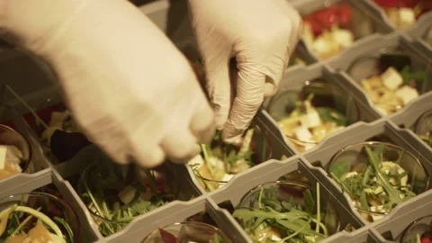 Hands in gloves preparing snacks for catering, close-up Video stock 172002057
