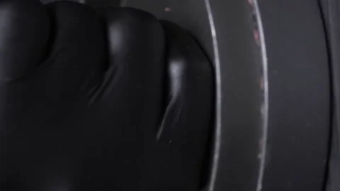 Hands in gloves press on the burger press. Forming a hamburger. Video stock 234009210