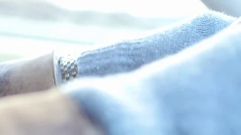 Hands in gloves on steering wheel close up in running car Stock Footage 70315587