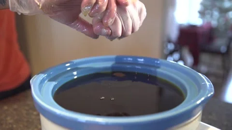 Hands With Gloves Tightly Squeezing Oil From The Filter Bags With Dried Stock Footage 135596248