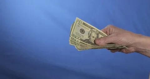 Hands grabbing for dollars. Video stock 71626643
