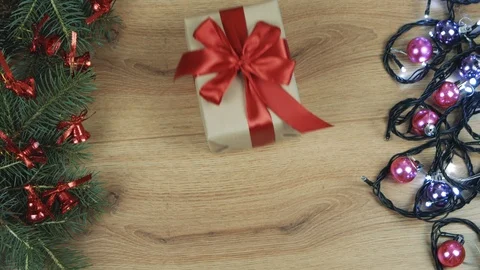 Hands grabbing gift boxes on light wooden flat lay. New year, christmas, top  Stock-Footage 110704551