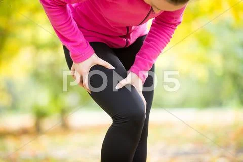 Hands grabbing a hip, sport injury Stock Photos