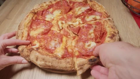 Hands Grabbing Pepperoni Pizza Slice Close-Up Stock Footage 326001711