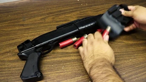 Hands Grabbing Shotgun Shells Stock Footage 79550047