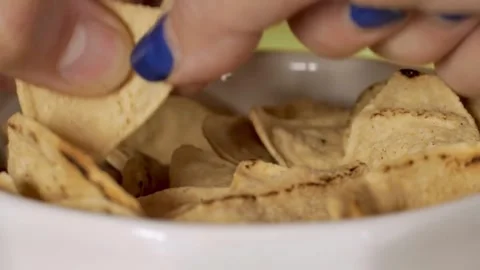 Hands grabbing tortilla chips. Stock Footage 305807490