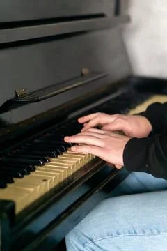 Hands gracefully playing the piano, capturing the essence of music, creativity Stock Photos