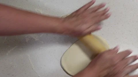 Hands of granny rolls a dough with a rolling pin. Stock Footage 238026021