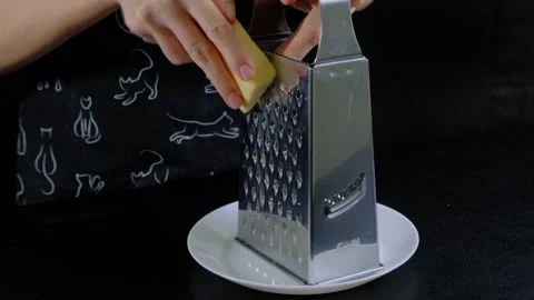 Hands Grating Cheese on Box Grater in Cooking Kitchen Stock-Footage 341423527