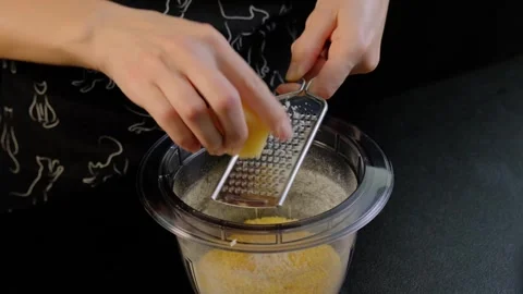 Hands Grating Cheese into Flour Mixture in Kitchen, Cooking Video stock 341452753