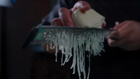 Hands Grating Fresh Mozzarella for Pizza Stock Footage 293277677