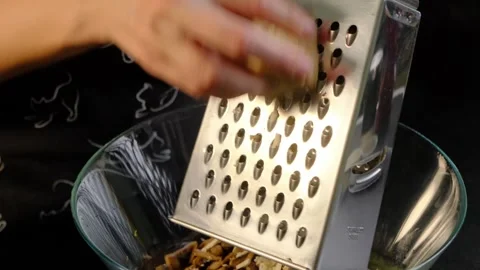 Hands Grating Root Vegetable in Kitchen Bowl Cooking Stock Footage 341439434