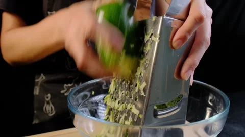 Hands Grating Zucchini in Kitchen Cooking Stock Footage 341418745