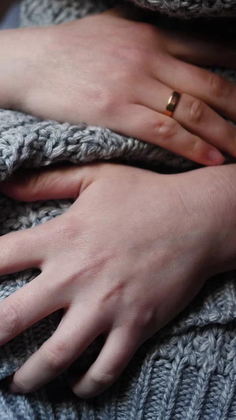 Hands in Gray Knitted Sweater Close Up Vertical Stock Footage 334789173