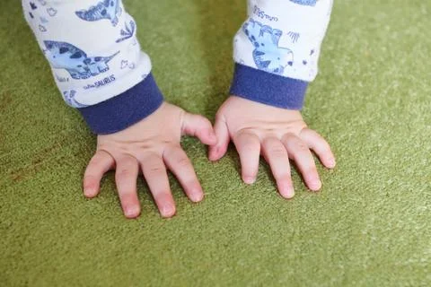 Hands on green carpet Stock Photos