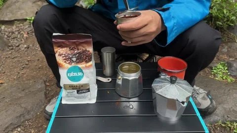 Hands Grinding Fresh Coffee Beans with Manual Grinder, Outdoor Camping, Medium S Stock Footage 324850828