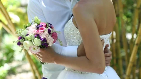 Hands of the groom hugging Bride Stock Footage 55810134
