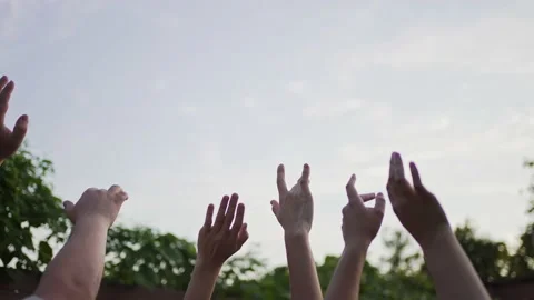Hands of a group dancing people in the sky at sunset. Concert. Friendship and Stock Footage 159069750