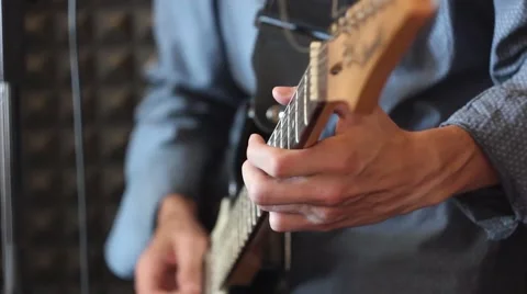 Hands on the guitar neck Stock Footage 65289713
