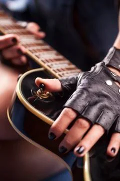 Hands on guitar Stock Photos