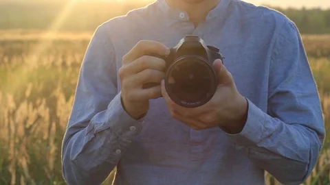 Hands of a guy holding a camera Stock Footage 94259968
