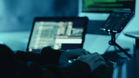 Hands of hacker typing security password, login breaks into company data servers Stock-Fotos