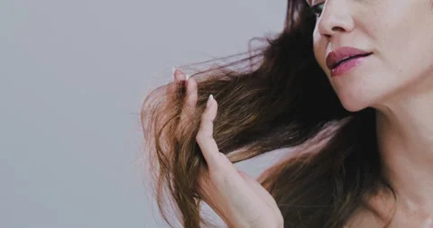 Hands, hair and split ends in studio with mature woman, check and mock up space Stock Footage 301082268