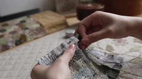 Hands hand sewing a decorative textile patchwork Video stock 315084862