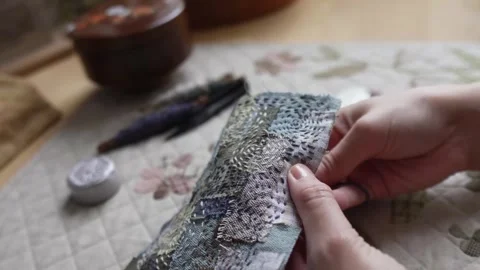 Hands hand sewing a decorative textile patchwork Video stock 315084863
