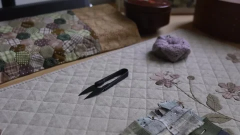 Hands hand sewing a decorative textile patchwork Video stock 315084868
