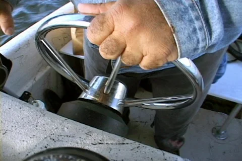 Hands Hand On The Wheel of a Boat Ship Helm Watercraft Stock Footage