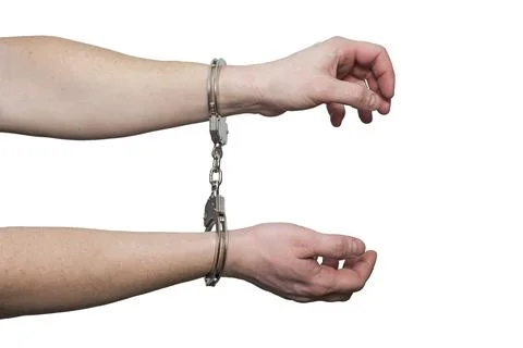 Hands in handcuffs.  Prisoner or arrested man , close-up of hands in handcuff Stock Photos