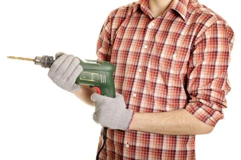 Hands handling an electric drilling machine Stock Photos