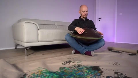 Hands with hang drum close up, man practicing meditation music Stock Footage 255786335