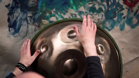 Hands with hang drum close up, man practicing meditation music Stock Footage 255888059
