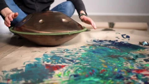 Hands with hang drum close up, man practicing meditation music Stock Footage 255888108