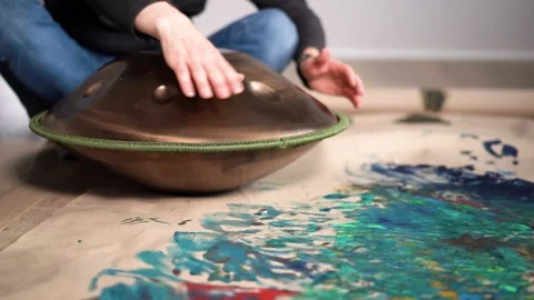 Hands with hang drum close up, man practicing meditation music Stock Footage 256093818