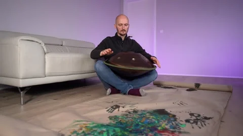 Hands with hang drum close up, man practicing meditation music Stock Footage 256093830