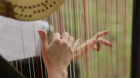 Hands of harpist playing harp. Close-up Stock Footage 45879641