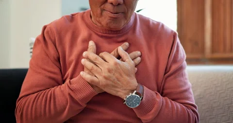 Hands, heart attack and senior man on sofa with lungs, problem or breathe, risk Stock Footage 254958835