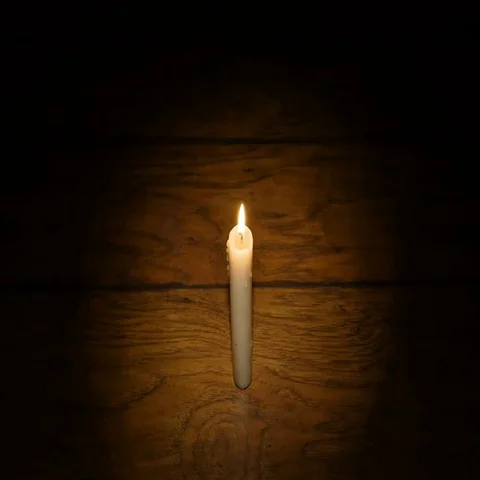 Hands Heated by Candles on the Dark Background Stock Footage 69382308