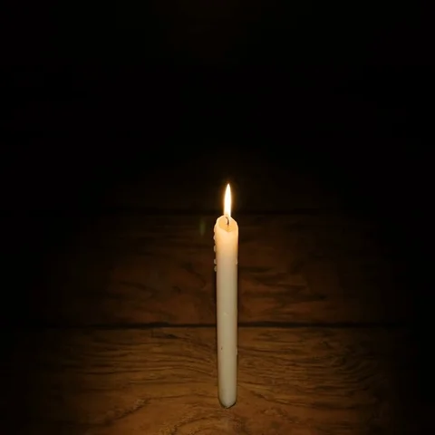 Hands Heated by Candles on the Dark Background Stock Footage 69383554