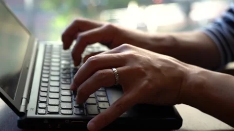 Hands to hit the keyboard at the cafe Stock Footage 150212239