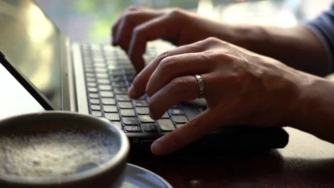 Hands to hit the keyboard at the cafe Stock Footage 150212385