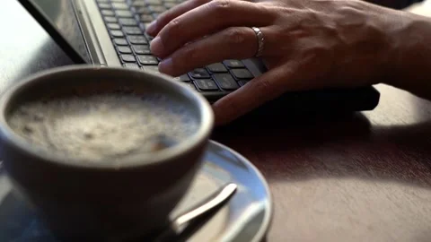 Hands to hit the keyboard at the cafe Stock Footage 150212479