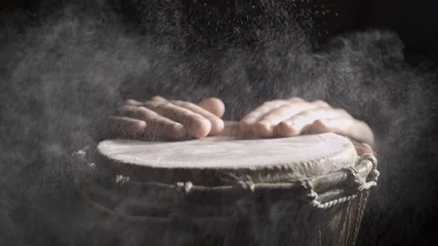 Hands hitting the djembe drum covered with talcum powder on the dark background Stock Footage 114063062