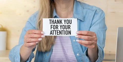 Hands hold a card with the text Creative concept Thank You For Your Attention Stock Photos